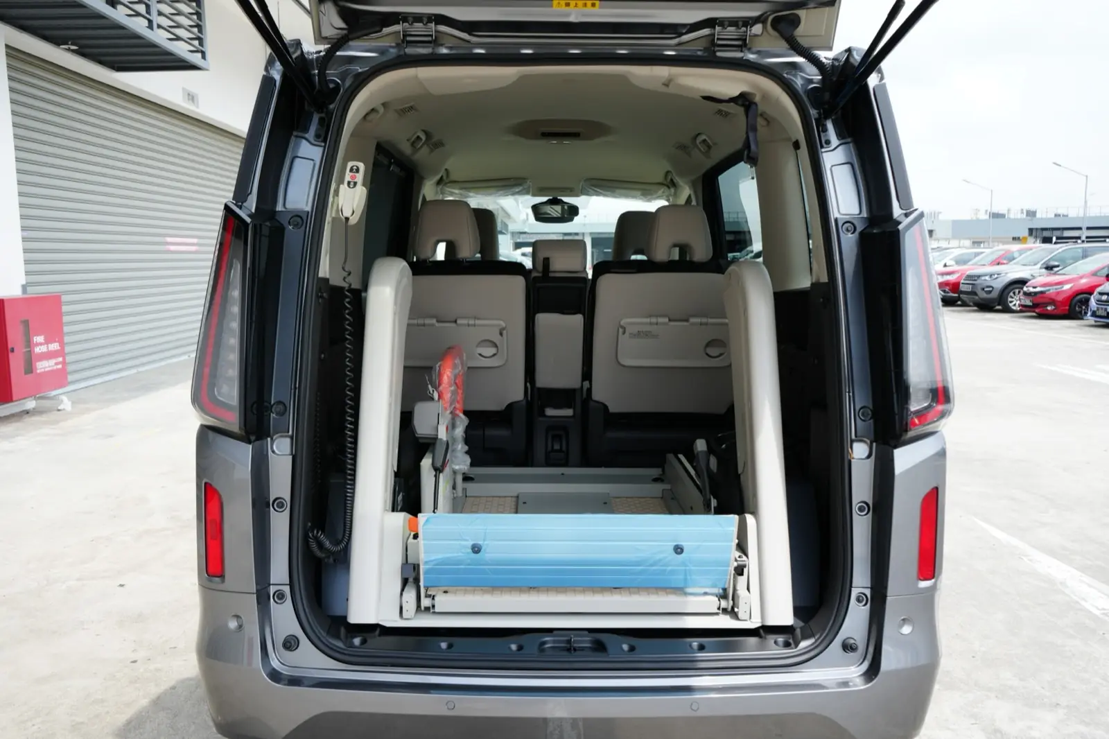 Ramp folded away inside the vehicle when not in use